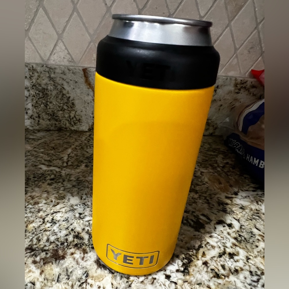 Yeti slim can cooler, yellow, new never used, do not have exact sizing